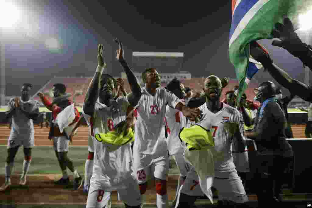 Gambia players celebrates at the end of the round of 16 match against Guinea in Cameroon, Jan. 24, 2022.