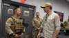 This handout picture provided by the U.S. Defense Department (DoD) shows Defense Secretary Pete Hegseth meeting with U.S. military personnel at Guantanamo Bay Naval Base, Feb. 25, 2025.