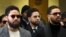 Actor Jussie Smollett, center, departs after an initial court appearance at the Leighton Criminal Courthouse, Feb. 24, 2020, in Chicago. 
