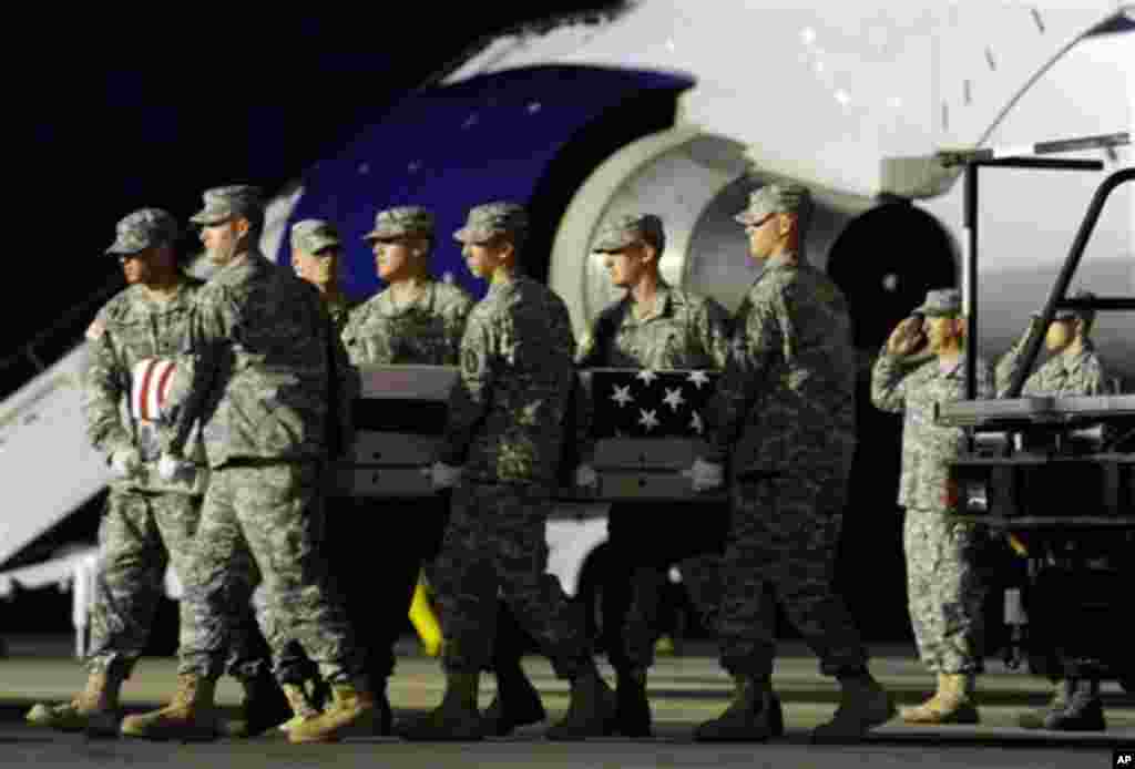 An Army carry team moves a transfer case containing the remains of Pvt. Danny Chen Wednesday, Oct. 5, 2011 at Dover Air Force Base, Delaware. (AP)