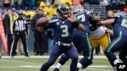 Seattle Seahawks quarterback Russell Wilson, prepares to throw in a game against the Green Bay Packers.