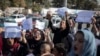 FILE - Afghan women chant during a protest in Kabul, Afghanistan, Oct. 21, 2021