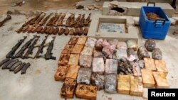 Ammunition and explosives seized from suspected members of Hezbollah are displayed after a raid of a building in Nigeria's northern city of Kano, May 30, 2013 file photo. 