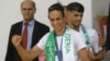 FILE - Gold medalist in the the women's 66 kg boxing Algeria's Imane Khelif, left, and bronze medalist in the men's 800m Djamel Sedjati arrive after the 2024 Summer Olympics, Aug. 12, 2024, at Algiers airport, Algeria. 