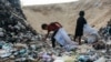 Children sift through waste at a landfill in Khan Yunis in the southern Gaza Strip on Oct. 15, 2024, amid the ongoing war between Israel and the Palestinian militant group Hamas in the besieged Palestinian territory. 