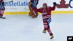 Washington Capitals left wing Alex Ovechkin celebrates the game-winning goal by teammate Troy Brouwer near the end of the NHL Winter Classic at Nationals Park in Washington, Jan. 1, 2015. 