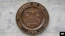 This May 4, 2021, photo shows the Department of the Treasury's seal outside the Treasury Building in Washington. 