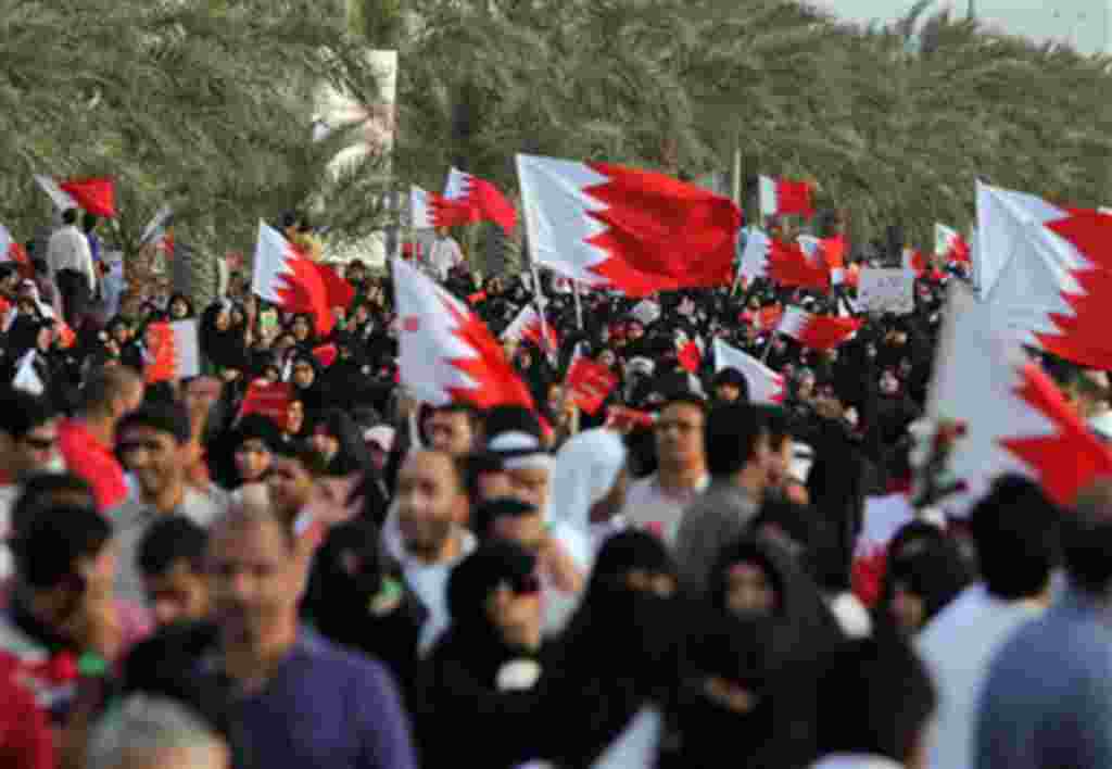 Anti-government protesters demonstrate, March 11, 2011, in Riffa, Bahrain, where a riot police barricade prevented tens of thousands of demonstrators from marching to the royal court