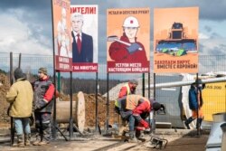 Workers finish construction of a new hospital for coronavirus patients outside the village of Golokhvastovo, some 60 kilometers southwest from the center of Moscow, April 20, 2020.