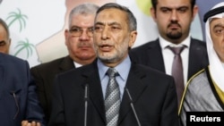 FILE - Iraqi Sunni lawmaker Mahmoud al-Mashhadani speaks during a news conference in Baghdad Aug. 23, 2014. 