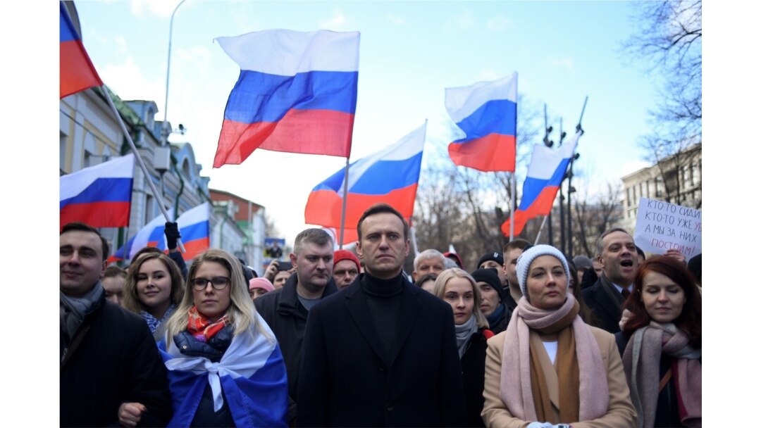 Russian opposition leader Alexei Navalny, his wife Yulia, opposition politician Lyubov Sobol and other demonstrators march in memory of murdered Kremlin critic Boris Nemtsov in downtown Moscow on February 29, 2020.