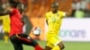 FILE: Zimbabwe's Knowledge Musona, right, and Uganda's Hassan Masanda Wasswa fight for the during the group A soccer match between Uganda and Zimbabwe at the Africa Cup of Nations at Cairo International Stadium in Cairo, Egypt, Wednesday, June 26, 2019. (AP Photo/Ariel Schalit)