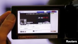 FILE - A screen grab of a hacked Facebook page of a French television network is seen on a camera viewer in Paris, April 9, 2015. U.S. Internet giants reached a deal with the EU Tuesday on ways to quickly tackle instances of online hate speech.