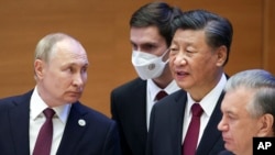 资料照：中国领导人习近平与俄罗斯总统普京在乌兹别克斯坦出席上海合作组织峰会期间会晤。（2022年9月16日）