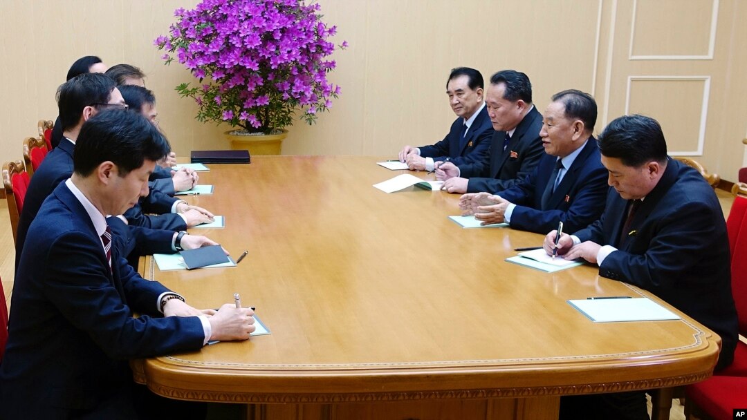 In this photo provided by South Korea Presidential Blue House via Yonhap News Agency, Kim Yong Chol, vice chairman of North Korea's ruling Workers' Party Central Committee, second from right, talks with South Korean delegation in Pyongyang, North Korea, March 5, 2018.