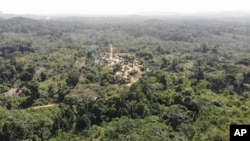 FILE—Yarkpa Town stands out in the surrounding rainforest in Rivercess County, Southeast Liberia, March 6, 2024.