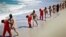 This undated image made from video released by Islamic State militants April 19, 2015, purports to show a group of captured Ethiopian Christians taken to a beach before being executed.