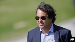 In this picture taken June 14, 2014, Rodrigo Paiva, spokesman of the Brazilian Soccer Confederation, attends a team training session at the Granja Comary training center in Teresopolis, Brazil.