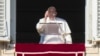 Pope Francis appears at his studio's window overlooking St. Peter's Square at The Vatican to bless pilgrims and faithful after presiding over a mass in St. Peter's Basilica on New Year's Day, Jan. 1, 2025. 