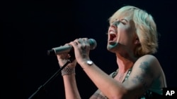 FILE - Dolores O'Riordan of Irish rock group "The Cranberries" performs at the Sant Jordi Club in Barcelona, Spain, Oct. 4, 2012. 