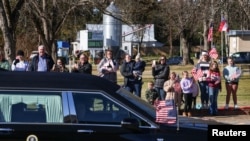 Former U.S. President Carter's casket travels to Atlanta, Georgia