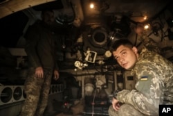 In this photograph  provided by Ukraine's 24th Mechanised Brigade property   service, Ukrainian soldiers are seen wrong  a M109 self-propelled howitzer successful  Chasiv Yar, Donetsk region, Ukraine, Oct. 23, 2024. (Oleg Petrasiuk/Ukrainian 24th Mechanised Brigade via AP)