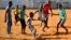 Children play soccer in Maputo, Mozambique, Nov.16, 2013. 