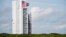 This NASA image shows an unmanned Atlas V rocket, which will hoist an Orbital ATK cargo capsule into space, rolling out of the vertical integration facility to the launch pad at Cape Canaveral, Fla., Dec. 2, 2015.