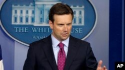 White House principal deputy press secretary Josh Earnest answers questions during his daily news briefing at the White House in Washington, Aug., 19, 2013.