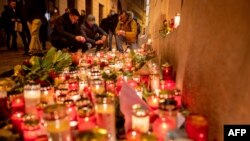 People light up candles outside Vienna's main synagogue near the site of the terrorist attack in Vienna, Austria on Nov. 4, 2020. 