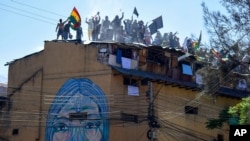 nmates protest on the roof of a San Sebastian prison, asking for better medical attention amid the pandemic and to be given the results from previously administered COVID-19 tests, in Cochabamba, Bolivia, July 27, 2020.