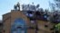 nmates protest on the roof of a San Sebastian prison, asking for better medical attention amid the pandemic and to be given the results from previously administered COVID-19 tests, in Cochabamba, Bolivia, July 27, 2020.