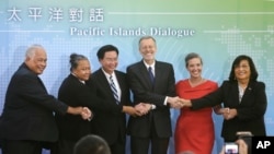 FILE - From left, Ambassador Jarden Kephas, Ambassador Limasene Teatu, Foreign Minister Joseph Wu, William Brent Christensen, Sandra Oudkirk, and Ambassador Neijon Rema Edwards at the Pacific Islands Dialogue in Taipei, Taiwan, on Oct. 7, 2019. (AP Photo/Chiang Ying-ying, File)