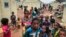 FILE - Children displaced by attacks gather in a makeshift camp for the displaced in Youba, Yatenga province, Burkina Faso, April 20, 2020.