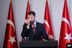 FILE - Turkish Finance Minister Berat Albayrak speaks during a conference to ease investor concerns about Turkey's economic policy, in Istanbul, Turkey, Nov. 8, 2020.