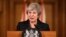 FILE - Britain's Prime Minister Theresa May speaks during a press conference inside 10 Downing Street in London, Nov. 15, 2018.