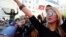 Supporters of Tunisian party Nida Tunis (Tunisia Calls) celebrate their victory in parliamentary elections in Tunis, Tuesday, Oct.28, 2014. 