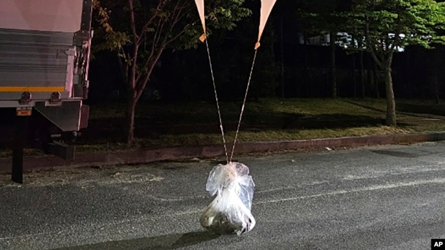 This photo provided by South Korea Defense Ministry, shows balloons with trash presumably sent by North Korea, in South Chungcheong Province, South Korea, May 29, 2024.