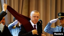 Turkey's President Recep Tayyip Erdogan arrives for the Global Refugee Forum at the United Nations in Geneva, Switzerland, Dec. 17, 2019.