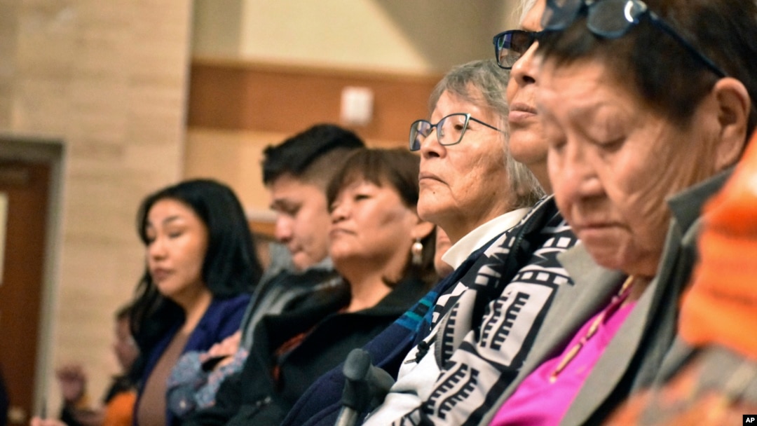 FILE - Elders from the Northern Cheyenne Tribe in Montana listen to speakers during a session for survivors of government-sponsored Native American boarding schools, in Bozeman, Montana, Nov. 5, 2023.
