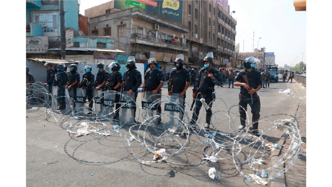 Iraqi security forces close streets to prevent anti-government protesters from reaching Tahrir Square in central Baghdad, Iraq, Oct. 2, 2019.