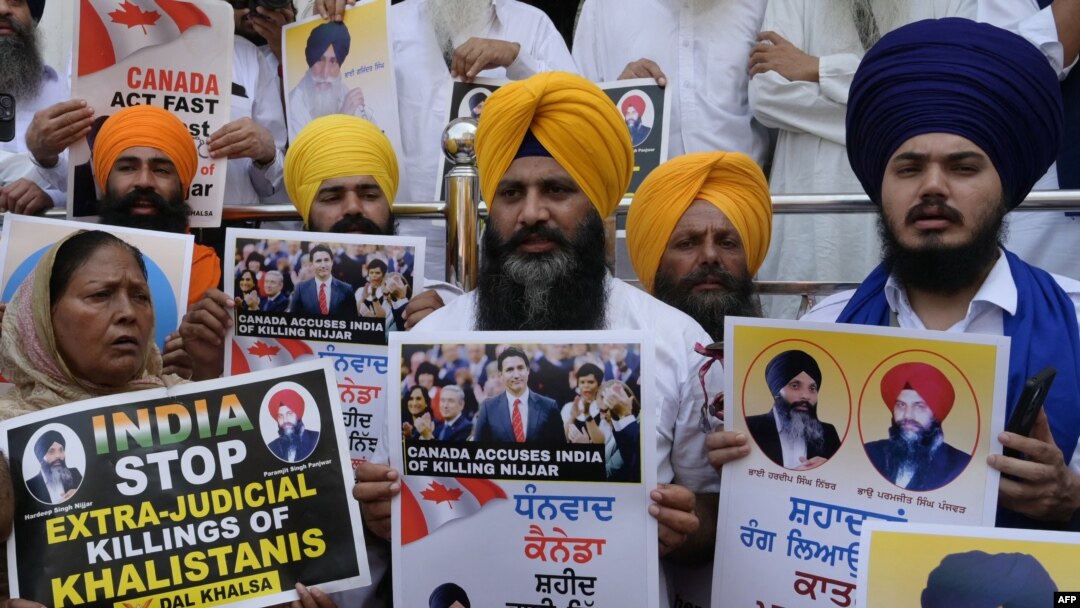 Activists of the Dal Khalsa Sikh organisation, a pro-Khalistan group, stage a demonstration demanding justice for Sikh separatist Hardeep Singh Nijjar, who was killed in June 2023 near Vancouver, after offering prayers at the at Akal Takht Sahib in the Go