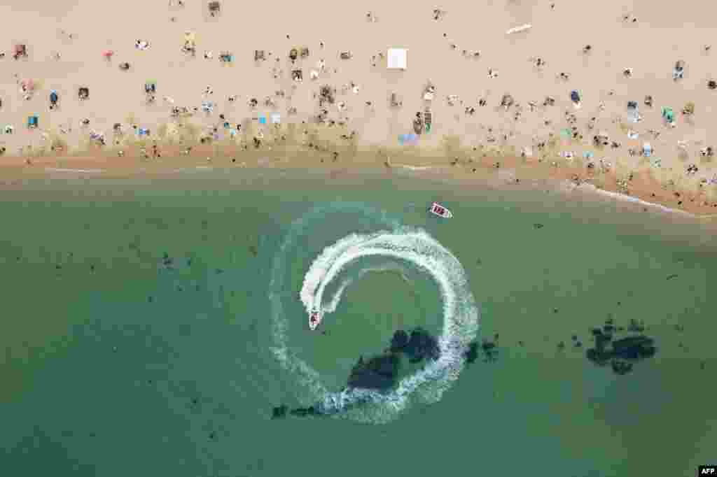 In an aerial photo, holiday-makers visit a beach in Sokcho, on South Korea's north-east coast, May 2, 2020.