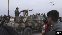 Syrian Kurdish gunmen control the area around Qamishli's airport in northeastern Syria on Dec. 8, 2024, following the fall of the capital Damascus to anti-government fighters.