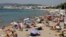 FILE - People enjoy the sun on a Croisette beach in Cannes, France.