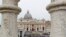 FILE - Faithful gather to follow Pope Francis celebrating Easter Mass in St. Peter's Square at the Vatican, Apr. 21, 2019.