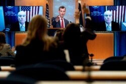 U.S. State Department spokesman Ned Price takes a reporter's question for Special Envoy for Yemen Timothy Lenderking at a State Department news conference in Washington, Feb. 16, 2021.