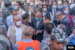 Egyptian Minister of Transportation Kamel El-Wazir (C) and several parliamentarians arrived at the scene a few hours after the crash in Qalioubia province, Egypt, April 18, 2021. (Hamada Elrasam/VOA)