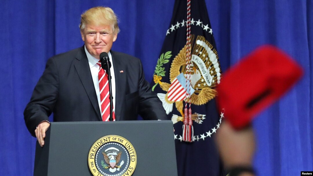 U.S. President Donald Trump is welcomed as he speaks to commanders and coalition representatives during a visit to U.S. Central Command and U.S. Special Operations Command at MacDill Air Force Base in Tampa, Florida, Feb. 6, 2017. 