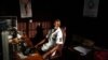 Communications student Mohamed Alpha Ba, 21, poses for a picture in the studio of the radio station he volunteers with, at Sierra Leone's prestigious Fourah Bay College in the capital Freetown, November 2012.